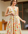 Front view of a sleeveless floral faux wrap dress featuring a V-neckline and fit-and-flare silhouette.