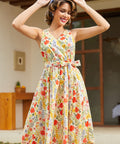 Woman styling a sleeveless fit-and-flare floral dress with a removable sash belt for spring and summer.