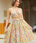 Vintage-inspired sleeveless cotton dress with colorful fruit stripe print, removable sash, back zipper, and side pockets.