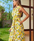 Side view of a cotton fit-and-flare shirt dress with a cheerful citrus print, functional pockets, and tie waist.
