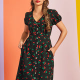 Front view of black cherry print casual dress with button-front closure and pockets