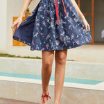 Navy blue wrap skirt with mermaid and nautical novelty print front view