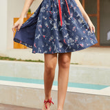 Navy blue wrap skirt with mermaid and nautical novelty print front view
