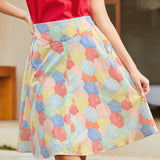 Woman wearing a 1950's inspired colorful patterned skirt