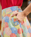 Close-up of umbrella print skirt showing pocket detail and waistband