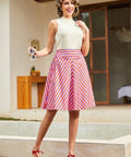 Model wearing retro striped circle skirt with high waist and flared silhouette