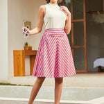 Model wearing retro striped circle skirt with high waist and flared silhouette
