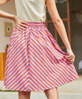 Back view of pink striped skirt with elastic waistband and chevron stripe pattern