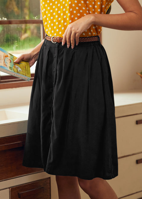 Black button front midi skirt with functional pockets and soft gathered silhouette