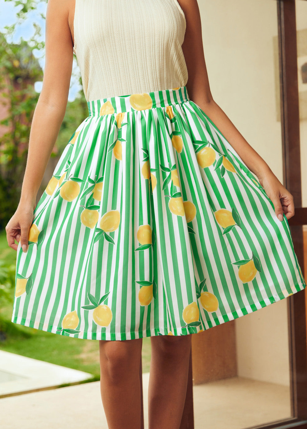 Fit and flare skirt with lemon print and green stripes, front view