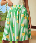 Close-up of gathered waist skirt with lemon print and stripe pattern