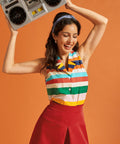 Woman wearing a relaxed-fit striped sleeveless blouse with vintage-inspired styling.