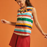 Side view of the rainbow striped cotton blouse with button-front closure.