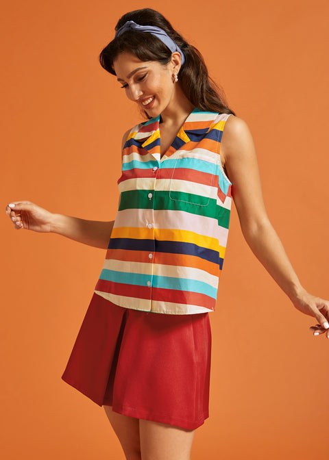 Side view of the rainbow striped cotton blouse with button-front closure.