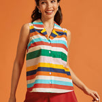 Woman wearing a retro rainbow striped sleeveless button-front top with a chest pocket.