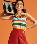 Woman posing with a boombox while wearing a sleeveless multicolor striped cotton blouse.