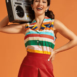 Woman posing with a boombox while wearing a sleeveless multicolor striped cotton blouse.