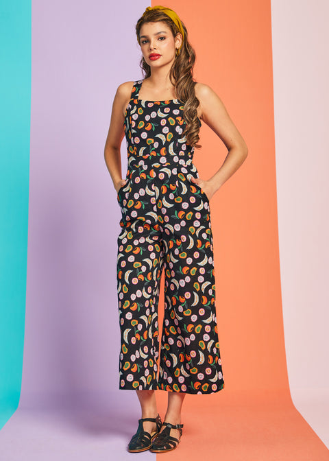 Front view of black fruit print wide-leg jumpsuit with square neckline