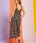 Back view of cropped wide-leg fruit print jumpsuit with bow tie detail