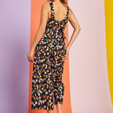 Back view of cropped wide-leg fruit print jumpsuit with bow tie detail