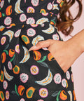 Close-up of colorful fruit print fabric with side pocket detail