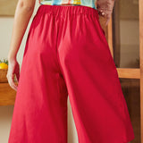 Back view of red skort with elastic waistband and clean tailored fit