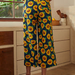 Back view of sunflower palazzo pants with elastic waistband and wide-leg silhouette