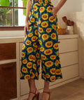 Navy wide-leg palazzo pants with sunflower print styled with matching sleeveless top front view