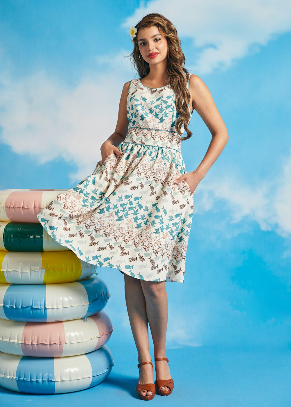Woman twirling in vintage-inspired fit-and-flare dress with full skirt