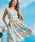 Woman posing in sleeveless coastal-inspired fit-and-flare dress