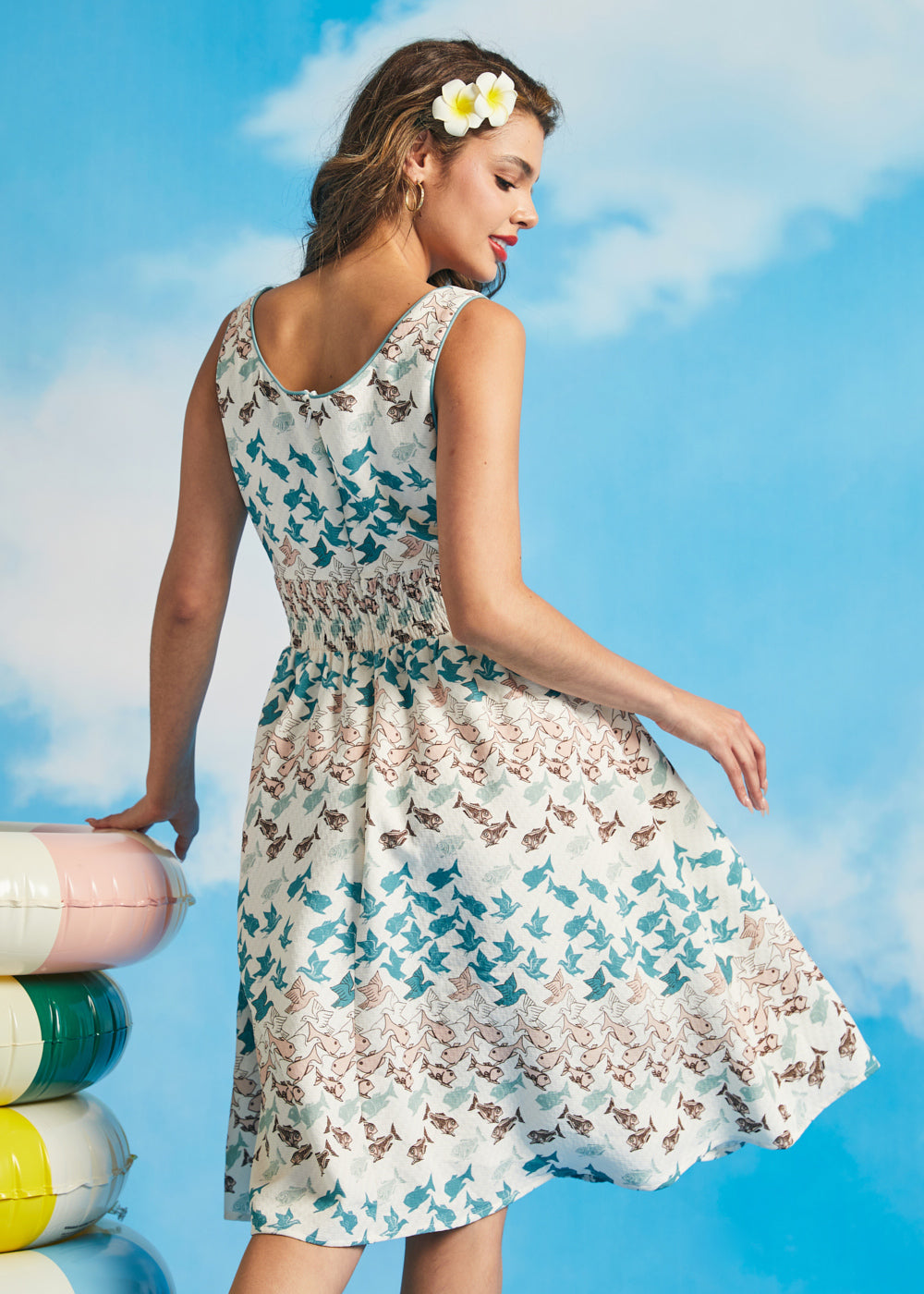 Back view of sleeveless fit-and-flare dress with smocked back panel