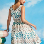 Back view of sleeveless fit-and-flare dress with smocked back panel