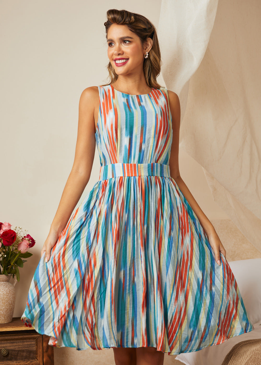 Woman wearing colorful striped midi dress with vintage-inspired silhouette
