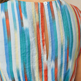 Close-up back detail of striped dress with button keyhole closure