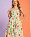 Woman wearing vintage-style cotton sundress with gathered waist and full skirt