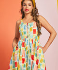Woman modeling vintage-inspired cotton sundress in Painted Picnic print with pockets
