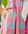 Close-up of plaid cotton dress with side pocket detail
