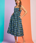Sleeveless teal fit-and-flare midi dress with pastel ice cream cone pattern