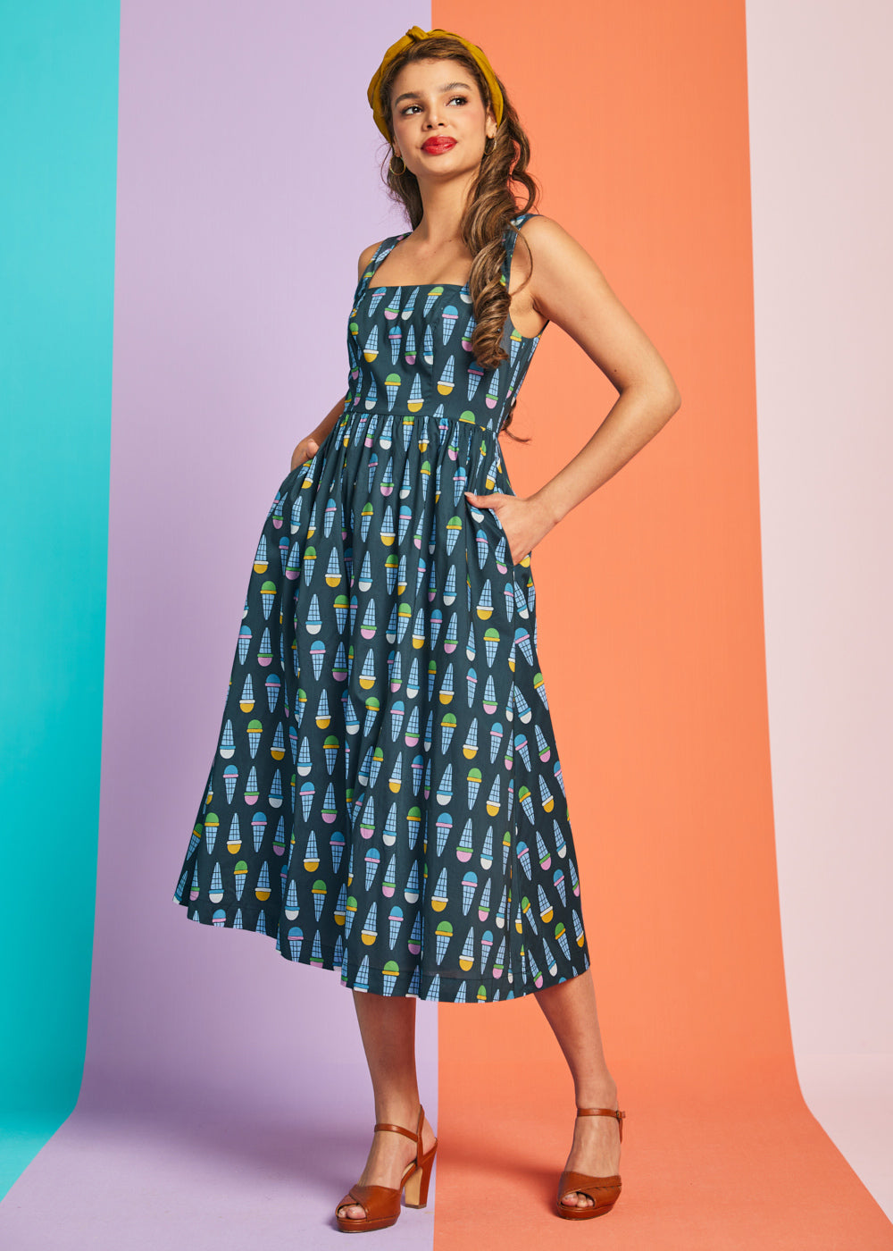 Sleeveless teal fit-and-flare midi dress with pastel ice cream cone pattern