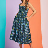 Sleeveless teal fit-and-flare midi dress with pastel ice cream cone pattern