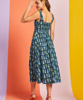 Back view of teal novelty print midi dress with smocked back panel