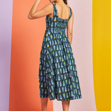 Back view of teal novelty print midi dress with smocked back panel
