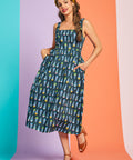 Woman posing in retro cotton sundress with colorful ice cream print