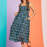 Woman posing in retro cotton sundress with colorful ice cream print