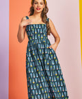 Woman wearing teal ice cream print midi dress with square neckline