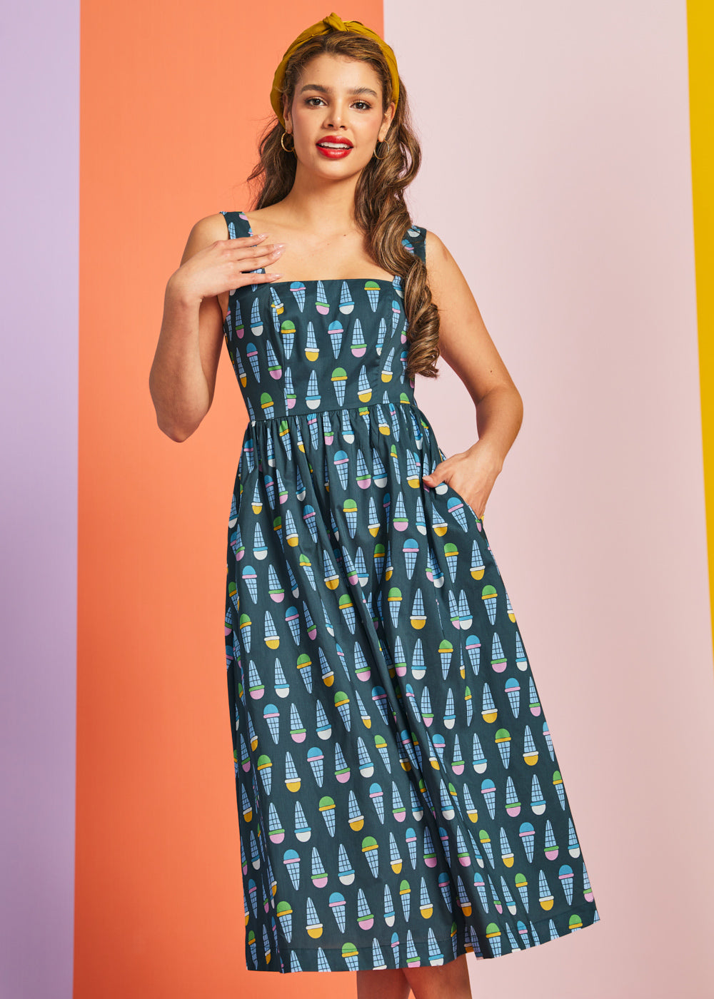 Woman wearing teal ice cream print midi dress with square neckline