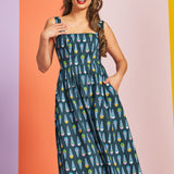 Woman wearing teal ice cream print midi dress with square neckline