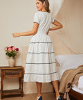 Back view of midi dress with smocked waist and full skirt