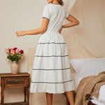 Back view of midi dress with smocked waist and full skirt
