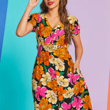 Woman wearing vintage-inspired floral button-front midi dress with pockets